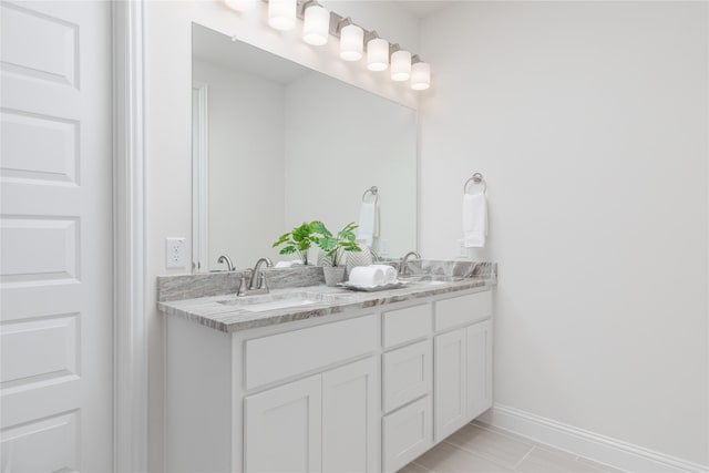 564 Embargo Dr, Fate, TX 75189 - full bath with baseboards, a sink, and double vanity