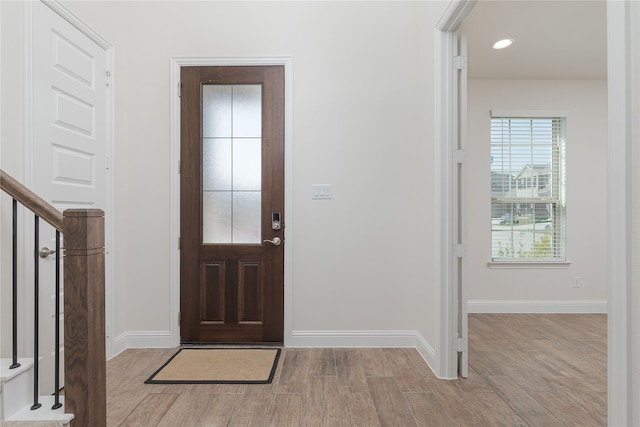 564 Embargo Dr, Fate, TX 75189 - entrance foyer featuring baseboards, wood finished floors, recessed lighting, and stairs