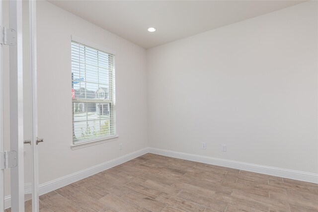 564 Embargo Dr, Fate, TX 75189 - spare room with recessed lighting, light wood-type flooring, and baseboards