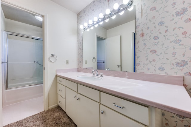 full bath with wallpapered walls, baseboards, bath / shower combo with glass door, and vanity