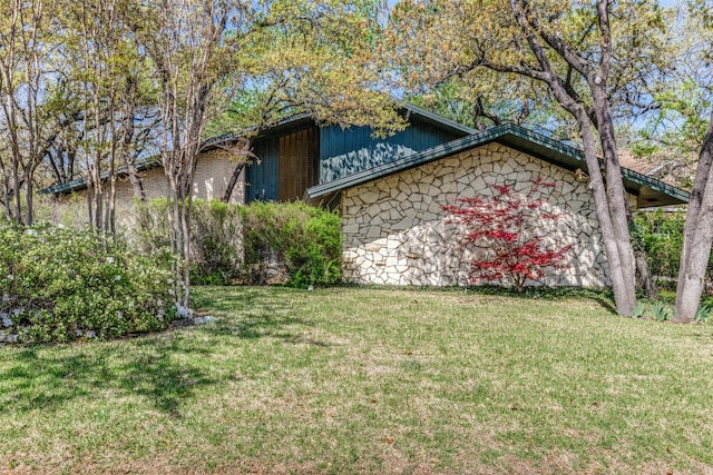 2911 Nottingham Dr, Denton, TX 76209 - view of home's exterior with a lawn and stone siding