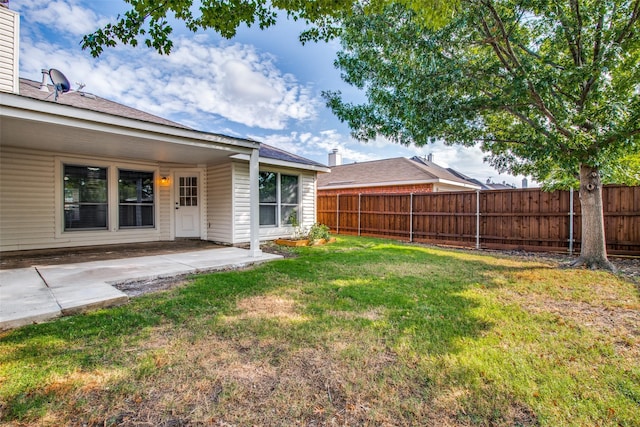 view of yard featuring a patio and a fenced backyard