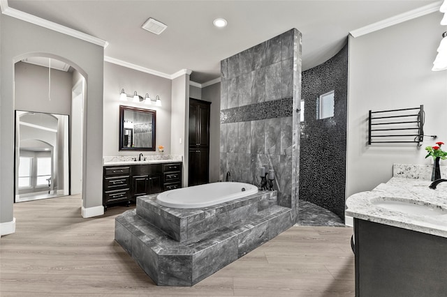 160 Pioneer Ct, Royse City, TX 75189 - bathroom featuring crown molding, two vanities, a bath, recessed lighting, and a walk in shower