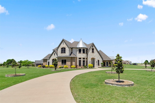 160 Pioneer Ct, Royse City, TX 75189 - french country style house featuring stone siding, a front lawn, and brick siding