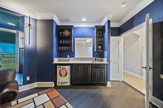160 Pioneer Ct, Royse City, TX 75189 - indoor wet bar featuring crown molding, dark wood-style floors, and baseboards