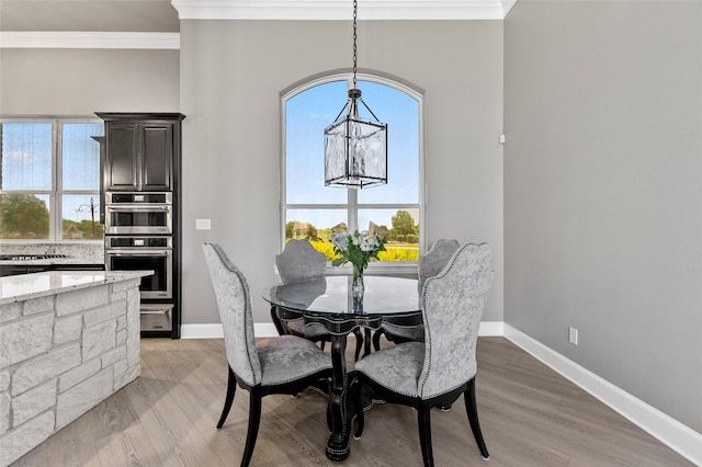 160 Pioneer Ct, Royse City, TX 75189 - dining room with crown molding, plenty of natural light, baseboards, and light wood finished floors