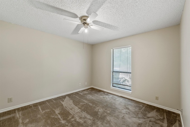 unfurnished room featuring carpet floors, baseboards, a ceiling fan, and a textured ceiling