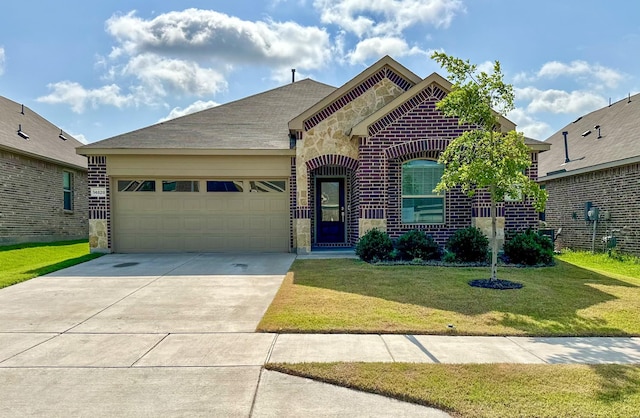 14828 Devils Claw Trl, Fort Worth, TX 76052 - french country inspired facade with an attached garage, concrete driveway, a front lawn, stone siding, and brick siding