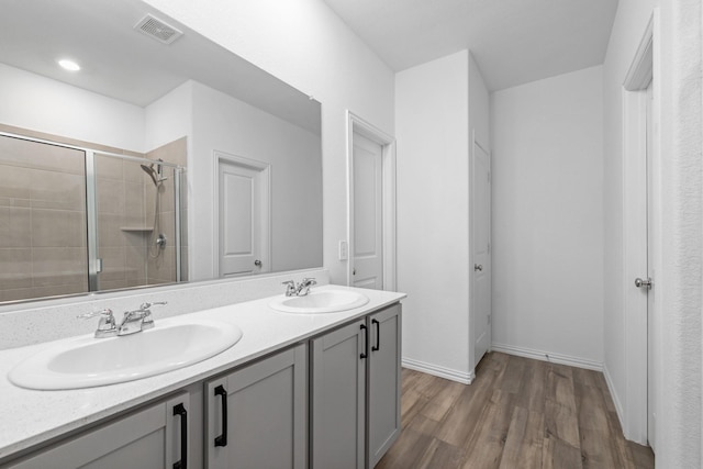 14828 Devils Claw Trl, Fort Worth, TX 76052 - full bathroom with double vanity, wood finished floors, and a shower stall