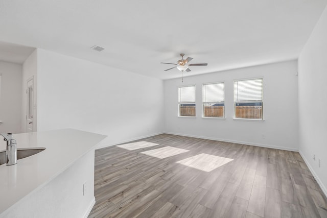 14828 Devils Claw Trl, Fort Worth, TX 76052 - unfurnished living room with ceiling fan and light wood-style flooring