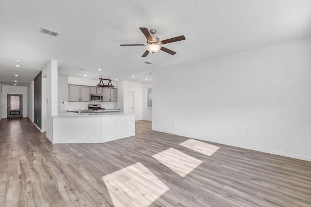 14828 Devils Claw Trl, Fort Worth, TX 76052 - unfurnished living room with light wood-style floors, recessed lighting, and ceiling fan