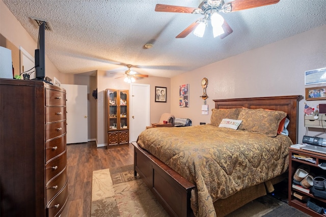 1511 Dolly Ln, Hideaway, TX 75771 - bedroom with a textured ceiling, dark wood-style flooring, and ceiling fan