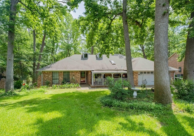1511 Dolly Ln, Hideaway, TX 75771 - view of front of property featuring a front yard, covered porch, and brick siding