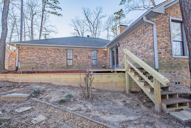 1511 Dolly Ln, Hideaway, TX 75771 - rear view of property with brick siding and a chimney
