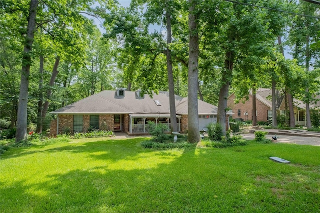 1511 Dolly Ln, Hideaway, TX 75771 - view of front facade with an attached garage, a front yard, and brick siding
