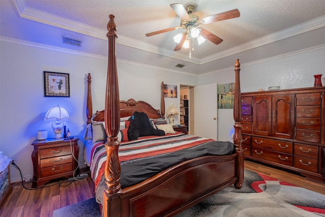 1511 Dolly Ln, Hideaway, TX 75771 - bedroom with wood finished floors, a textured ceiling, crown molding, and a ceiling fan