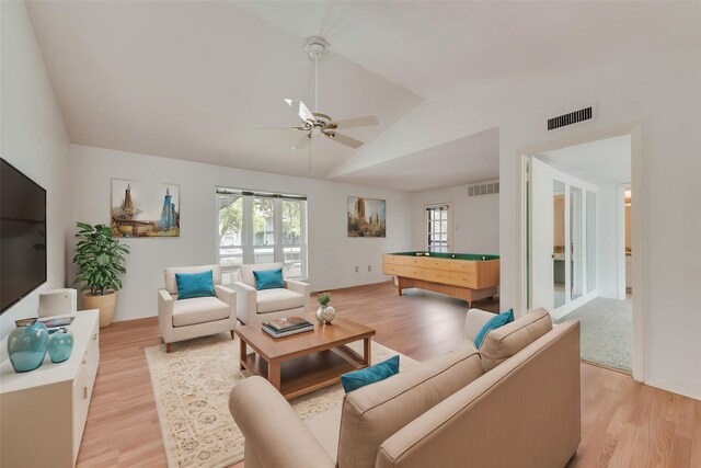 10550 High Hollows Dr Unit 233, Dallas, TX 75230 - living room with lofted ceiling, light wood-type flooring, healthy amount of natural light, and ceiling fan