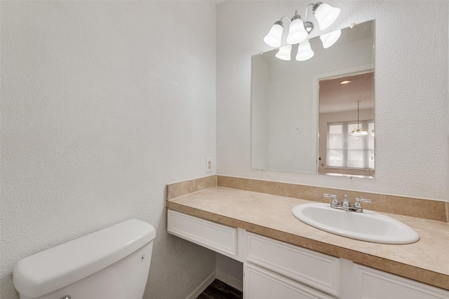 10550 High Hollows Dr Unit 233, Dallas, TX 75230 - bathroom with a chandelier, vanity, and toilet