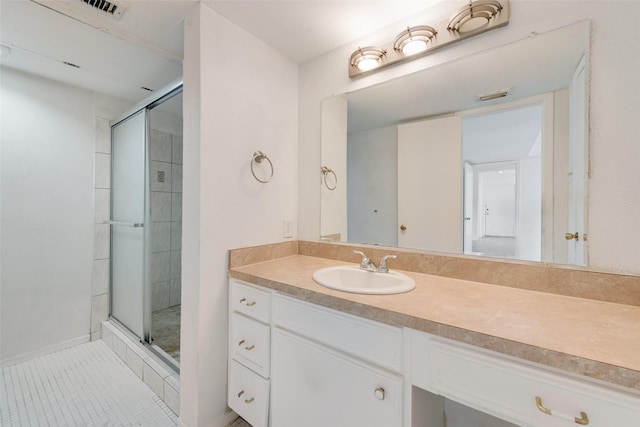 10550 High Hollows Dr Unit 233, Dallas, TX 75230 - bathroom with a shower stall, vanity, and tile patterned floors