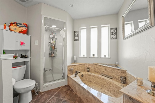 full bath with toilet, a bath, a stall shower, and tile patterned flooring
