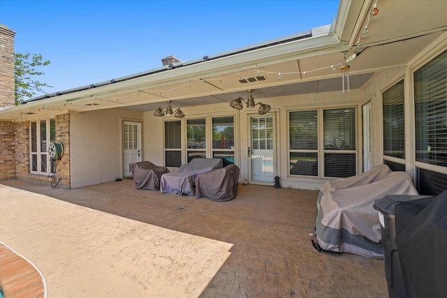 view of patio with a grill