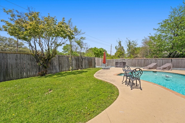 view of swimming pool featuring a patio area, a fenced backyard, a fenced in pool, and a yard
