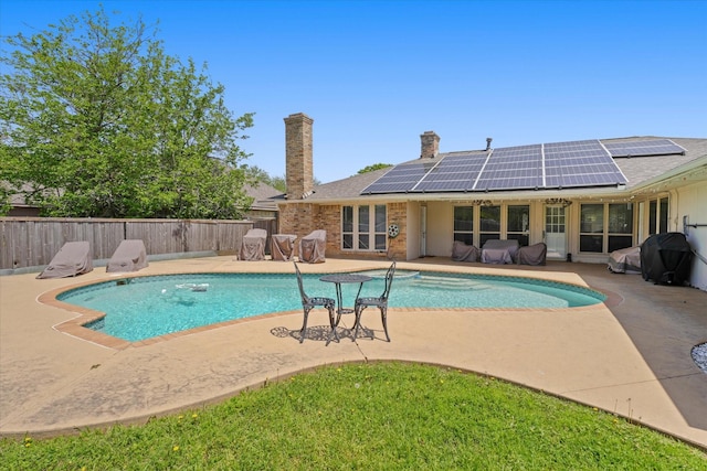 view of swimming pool with a grill, a patio, a fenced backyard, and a fenced in pool