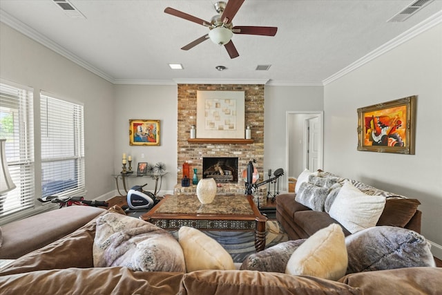 living room with visible vents, baseboards, and crown molding