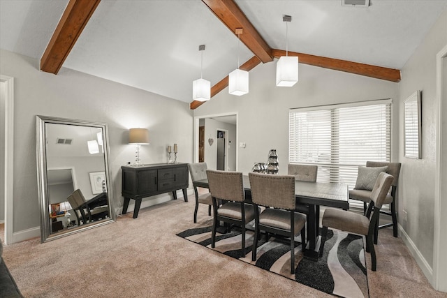 carpeted dining area featuring baseboards, vaulted ceiling with beams, and visible vents