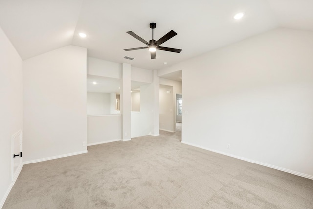 carpeted empty room featuring vaulted ceiling, ceiling fan, recessed lighting, and baseboards
