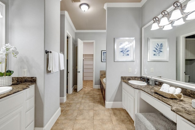 1121 Crystal Falls Dr, Prosper, TX 75078 - bathroom with crown molding, two vanities, baseboards, a garden tub, and a spacious closet