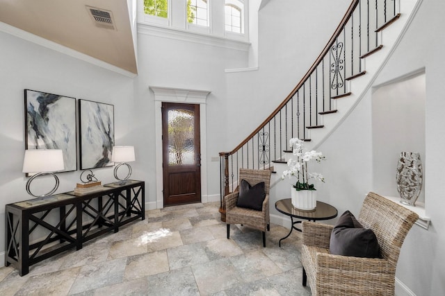 1121 Crystal Falls Dr, Prosper, TX 75078 - entrance foyer featuring baseboards, plenty of natural light, stone finish flooring, stairway, and a high ceiling