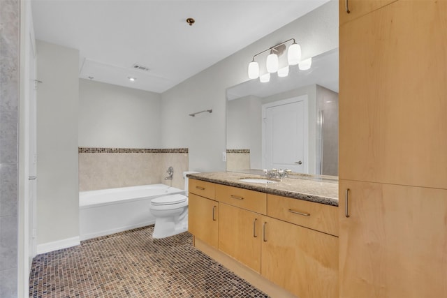 bathroom with vanity, toilet, tile patterned flooring, and a bath