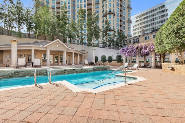 pool featuring a patio and fence