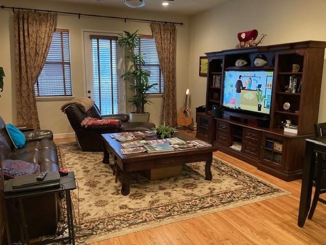 living area featuring light wood-style floors and recessed lighting