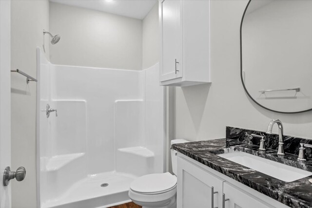 2377 Ridgley Dr, Flint, TX 75762 - full bathroom with a shower, toilet, and vanity