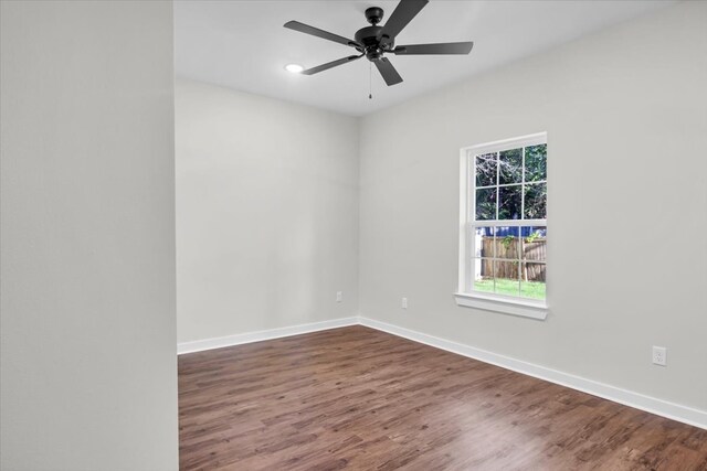 2377 Ridgley Dr, Flint, TX 75762 - empty room featuring dark wood finished floors, ceiling fan, baseboards, and recessed lighting