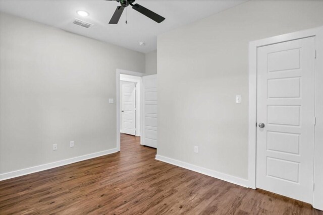2377 Ridgley Dr, Flint, TX 75762 - unfurnished bedroom featuring baseboards, dark wood finished floors, and a ceiling fan