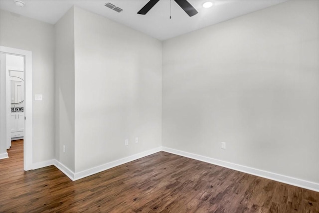 2377 Ridgley Dr, Flint, TX 75762 - spare room featuring a ceiling fan, baseboards, and dark wood-type flooring