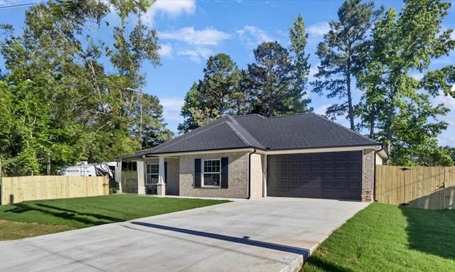 2377 Ridgley Dr, Flint, TX 75762 - ranch-style home featuring a garage, concrete driveway, brick siding, and roof with shingles