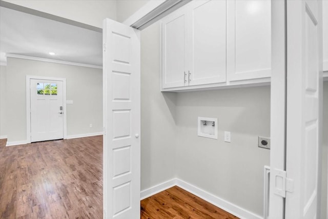 2377 Ridgley Dr, Flint, TX 75762 - laundry area featuring cabinet space, electric dryer hookup, crown molding, baseboards, and wood finished floors