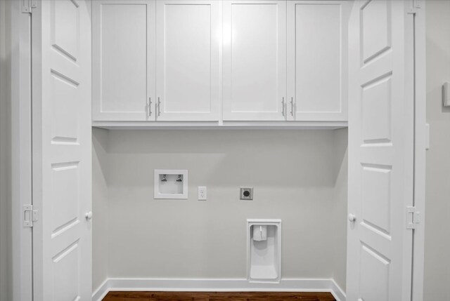 2377 Ridgley Dr, Flint, TX 75762 - washroom featuring washer hookup, baseboards, and dark wood-type flooring