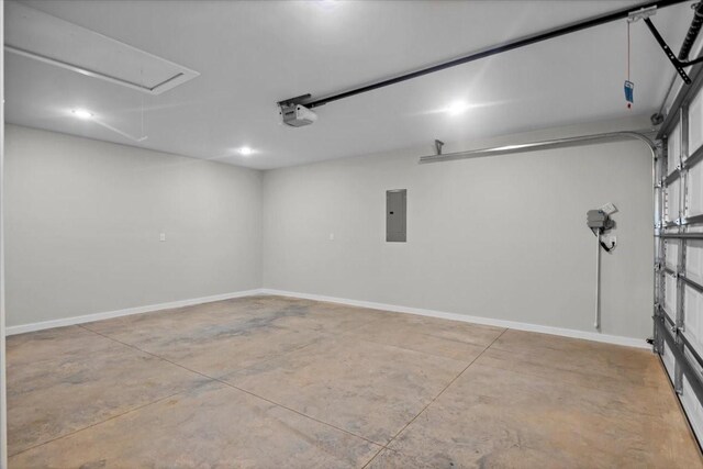 2377 Ridgley Dr, Flint, TX 75762 - garage with electric panel, a garage door opener, baseboards, and recessed lighting