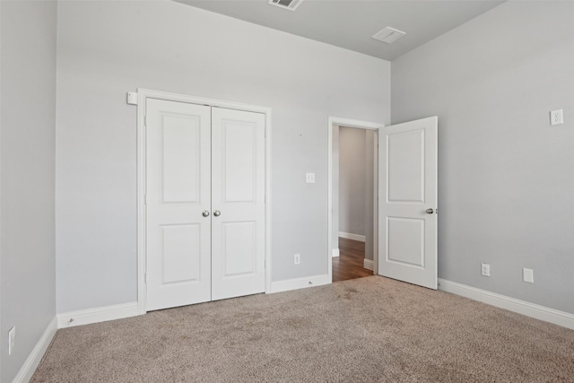 1909 Old Charm Trl, Wylie, TX 75098 - unfurnished bedroom with carpet, a closet, baseboards, and visible vents