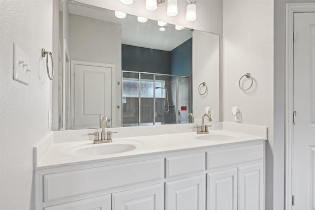 1909 Old Charm Trl, Wylie, TX 75098 - bathroom featuring double vanity, a stall shower, and a sink