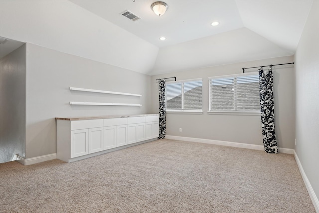 1909 Old Charm Trl, Wylie, TX 75098 - unfurnished room with lofted ceiling, recessed lighting, baseboards, visible vents, and carpet floors