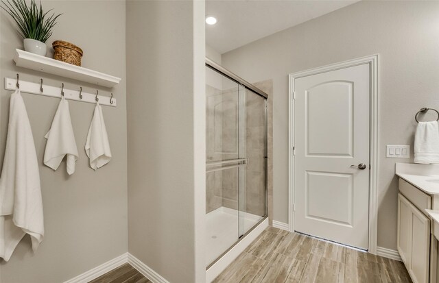 1814 Brindle St, Northlake, TX 76247 - full bath featuring baseboards, wood finished floors, a stall shower, and vanity