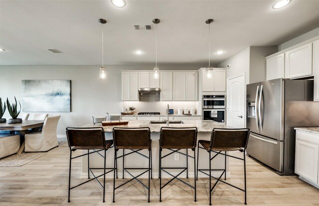1814 Brindle St, Northlake, TX 76247 - kitchen with white cabinetry, a breakfast bar area, appliances with stainless steel finishes, and visible vents