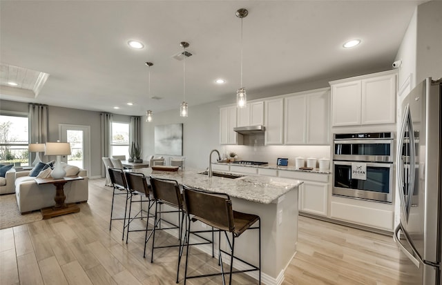 1814 Brindle St, Northlake, TX 76247 - kitchen featuring visible vents, stainless steel appliances, a sink, open floor plan, and backsplash
