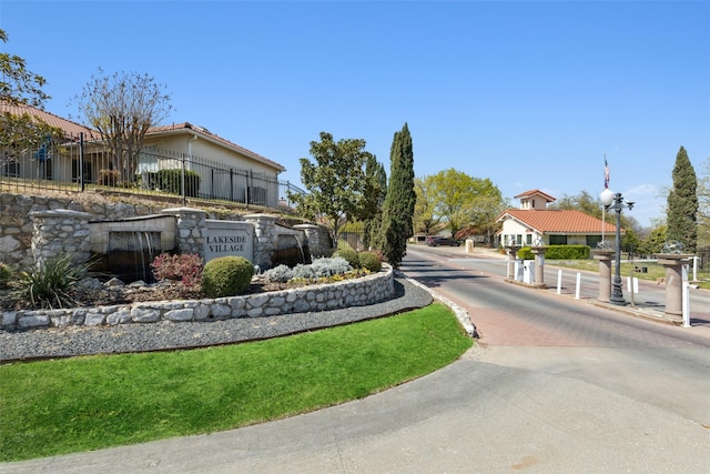 3931 Roma Ct, Rockwall, TX 75087 - view of road featuring a gated entry and curbs
